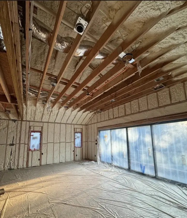 Interior walls and ceiling insulated with spray foam during new construction in Montclair